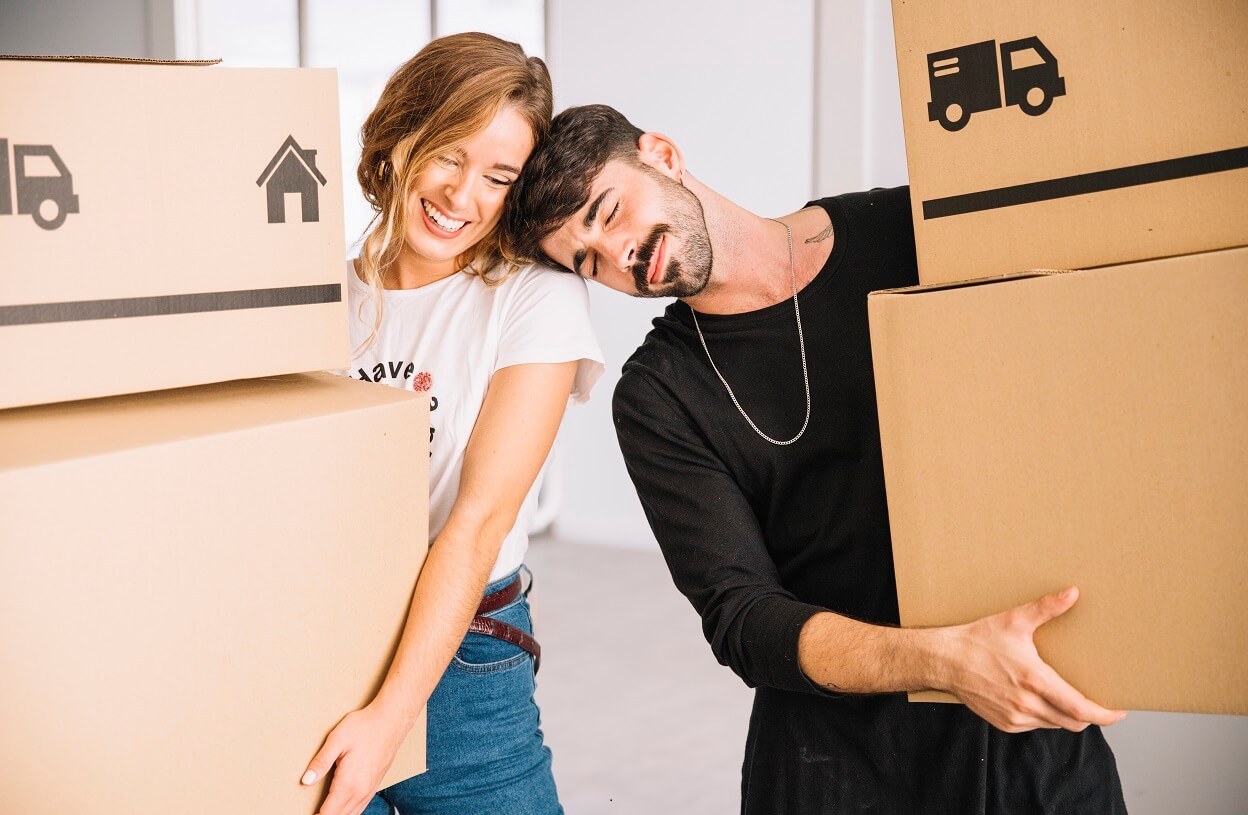 Happy customer shaking hands with reliable moving company