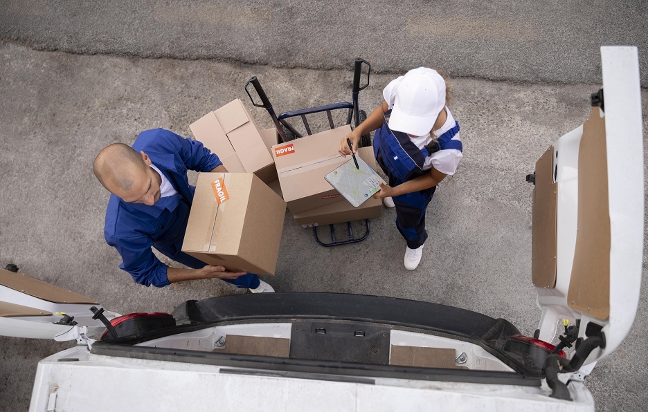 Tri-Cities moving team loading boxes into a truck in Port Moody