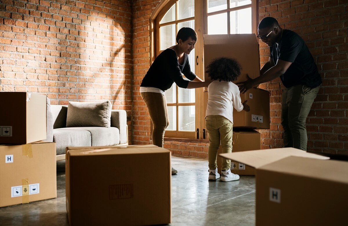 Movers carrying furniture into an apartment in Vancouver’s West End